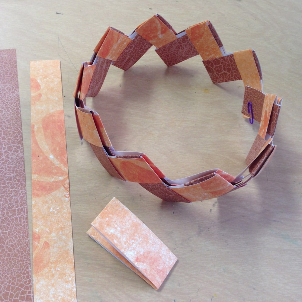 A gum wrapper paper chain, made with the help of a step by step tutorial.