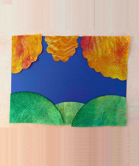 Cutting painted coffee filters into tree shapes for Coffee Filter Fall Tree Art.