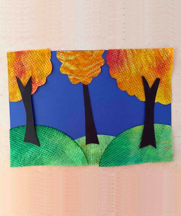 1. Cutting tree trunks and gluing the pieces together to finish the fall tree art.